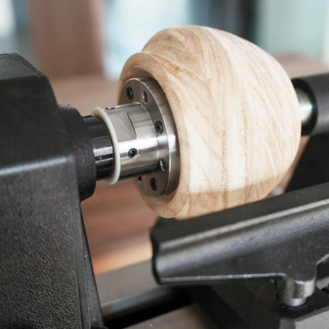 Heavy Duty 1x8Tpi Face Plate Kit For Woodturning Lathes Including 2 3 4 And 6 Inch Plates on a lathe with wooden piece.