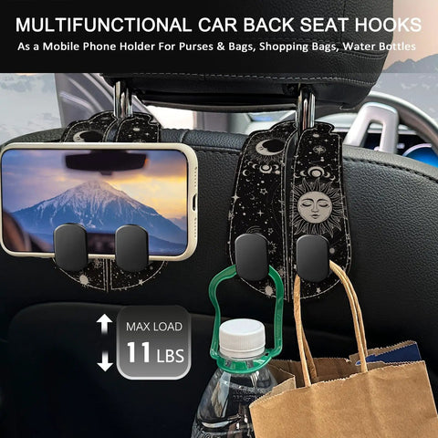 Two Piece Car Seat Headrest Hooks For Purse And Tote Bag Storage Chill Sun Moon Vibe Heavy Duty Metal Hooks Wrapped In Top Shelf Leather And Comfy Velvet Keeps Your Gear Tight with a phone holder and water bottle.