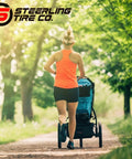 Jogger using a stroller with "Three Pack Jogging Stroller Tire Replacement Set With Two 16x1.75 Rear Tires And One 12.5x2.25 Front Tire BPA Latex Free Butyl Rubber For Real High Performance Safe Ride And Wide Compatibility With Three Wheel Strollers" on a park trail.