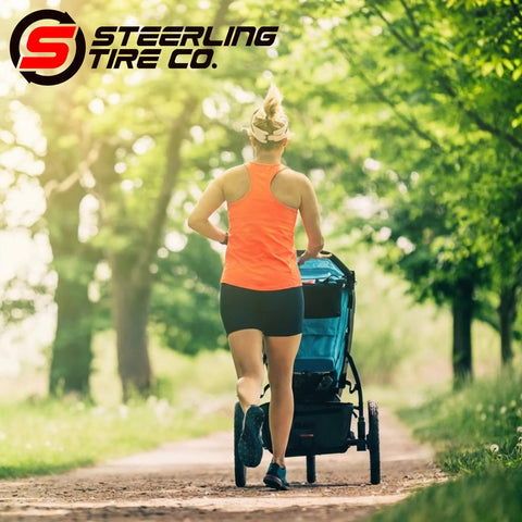 Jogger using a stroller with "Three Pack Jogging Stroller Tire Replacement Set With Two 16x1.75 Rear Tires And One 12.5x2.25 Front Tire BPA Latex Free Butyl Rubber For Real High Performance Safe Ride And Wide Compatibility With Three Wheel Strollers" on a park trail.