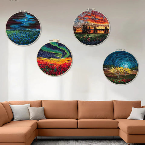 Four patterned cloths with nature scenes, part of Beginner Embroidery Starter Kit With Pattern Pack And Hoop, displayed above a sofa.