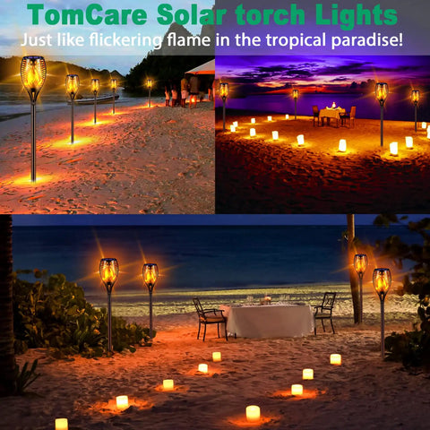 43 Inch Solar Flameless LED Torches With Flickering Flame Effect illuminating a beach pathway and dining setup at sunset.