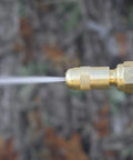 Close-up of the adjustable brass nozzle of the Pistol Grip Deluxe Sprayer For Lawn Care Greenhouse Roof Spraying at work