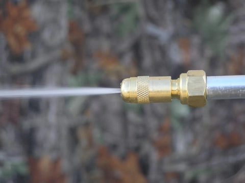 Close-up of the adjustable brass nozzle of the Pistol Grip Deluxe Sprayer For Lawn Care Greenhouse Roof Spraying at work