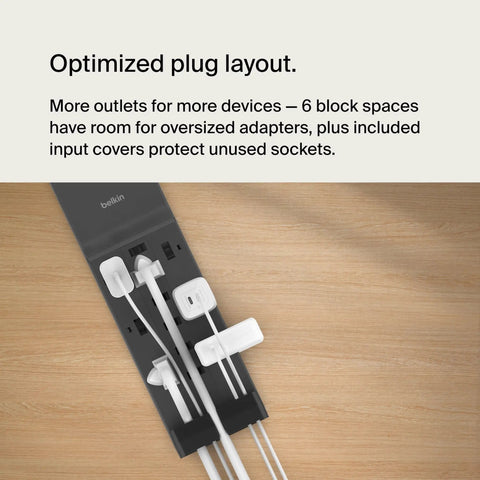 Top view of a black 12-Outlet Surge Protector Power Strip With 12 AC Outlets And 8ft Flat Plug on a wooden tabletop