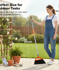 Commercial Grade Outdoor Broom With Stiff Bristles For Patios Garages Decks And Outdoor Kitchens Heavy Duty Sweep For Leaves Weeds Pet Hair Dirt And Dust Gray Straw Broom That Makes Outdoor Cleanup A Breeze held by woman outdoors