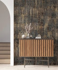 Room with Metallic Textured Wallpaper in Black and Gold Industrial Distressed Vibe behind a wooden cabinet