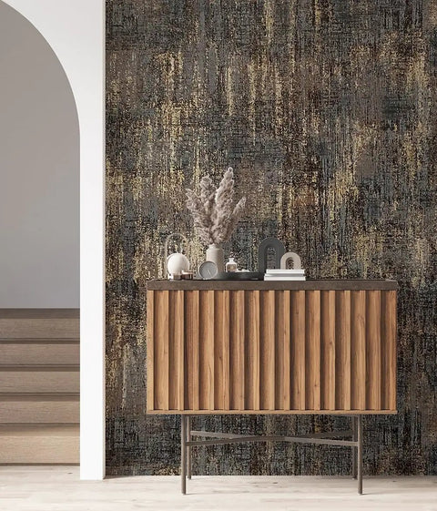 Room with Metallic Textured Wallpaper in Black and Gold Industrial Distressed Vibe behind a wooden cabinet