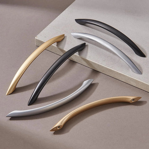Variety of modern cabinet handles including Matte Black Arch Drawer Pulls, showcasing different finishes and designs.