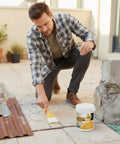 Person applying Clear Water Based Roof Sealant Quick Dry Leak Patch Brush On Waterproof Film High Bond Repair For Multi Crack Protection And Weather Resistant Barrier System on concrete