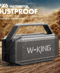Beast Bluetooth Speaker for Outdoors 100W Peak Power IPX6 Waterproof Boombox in rain showcasing durability.