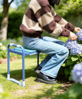 Person using Folding Garden Stool And Kneeler With Ten Point Two Inch Kneeling Pad Heavy Duty Garden Kneeler And Seat in blue