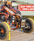 Orange ATV secured with 8 Pack 15 Foot Ratchet Straps With 1466 Lb Load Capacity And 4400 Lb Break Strength on a trailer