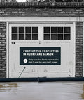 5 Foot Water Activated Flood Barriers For Home Doors And Garage in front of garage stopping floodwaters, sandless sand bags for quick flood control.