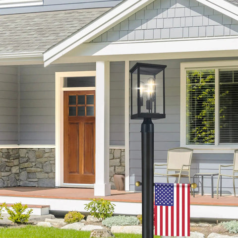 Outdoor Post Light With Clear Glass Panels In Sleek Black Finish Perfect For Patio Porch Driveway Garden And Walkways Modern Durable Exterior Lamp That Elevates Yards And Pathways With Bright Welcoming Glow And Curb Appeal in front of a house