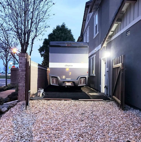 Camper parked on Vodaland Permeable Pavers EasyPave Grass And Gravel Driveway Grid 2 Inch Depth 35 Square Feet 14 Units Black