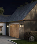 Two Light Outdoor Wall Lantern in Antique Bronze with Clear Beveled Glass, Rustic Traditional Style on garage exterior
