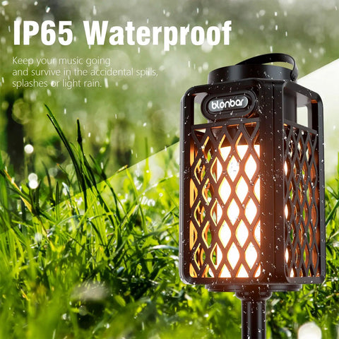 2-Pack Outdoor Torch Atmosphere Bluetooth Speakers, 10W Portable IP65 Waterproof LED Flame Lights in garden setting