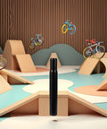 Sturdy Steel 25.4mm Bike Seat Post For Kids Bicycles Black Finish Fits 25.4mm Seat Tubes displayed in a playful park setting.