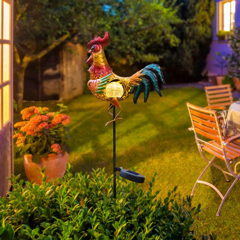 Rooster Solar Lights Outdoor Decor For Garden Yard Art Statue illuminating garden at night, metal rooster with vibrant colors.