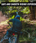Person riding an e-moto bike through a forest, showcasing the Stem Lock For E Motos Bar Mount Kit Fits Talaria Sting Talaria XXX Surron Light Bee E Ride Pro SS 79Bike Falcon M Segway X260 With Stem Cap Spacers And Bolt In Multiple Color Options.