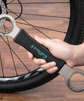 Hand holding 4 In 1 Bicycle Bottom Bracket Tool For Quick Removal And Installation, Compatible With Shimano, durable steel.