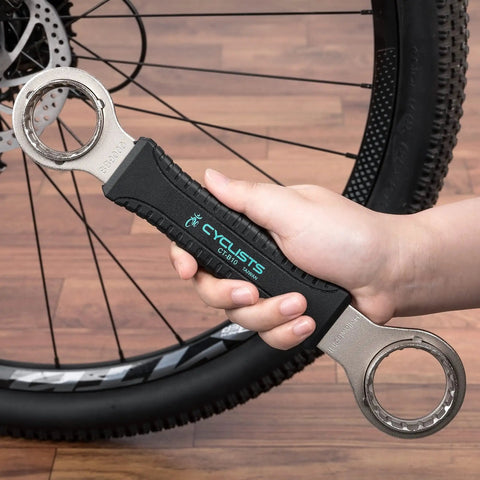 Hand holding 4 In 1 Bicycle Bottom Bracket Tool For Quick Removal And Installation, Compatible With Shimano, durable steel.