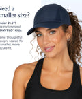 Woman wearing a navy cap designed with patented open back for ponytails, perfect for workouts and daily wear.