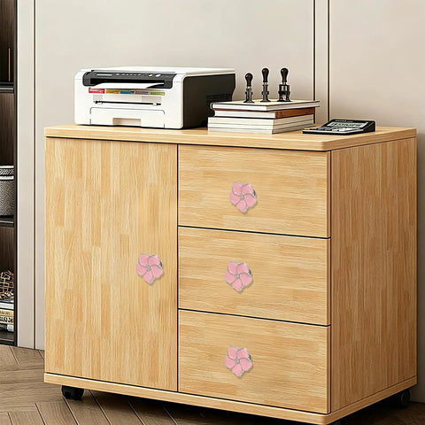 Top Shelf Pink Floral Cabinet Knobs And Drawer Pulls Set Of Four Damn Cute Petal Handles on a wooden cabinet with printer.