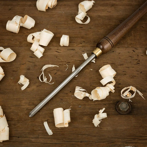 Three Eighths Inch HSS Bowl Gouge Lathe Chisel Set With 9 Inch High Speed Steel Blades, Thirteen Point Three Inch Teak Wood Handle, shown among wood shavings.