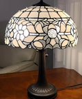 Vintage Tiffany Style Stained Glass Table Lamp 22 Inch Tall With White And Gray Mahogany Floral Shade on wooden table