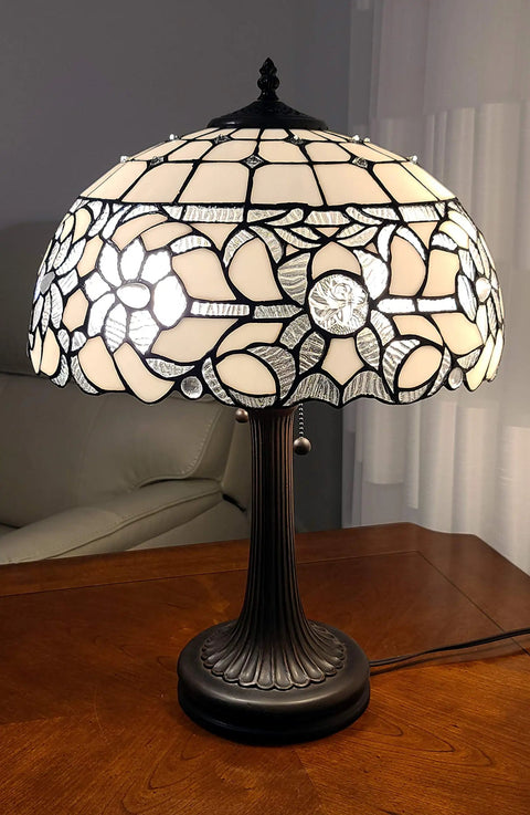 Vintage Tiffany Style Stained Glass Table Lamp 22 Inch Tall With White And Gray Mahogany Floral Shade on wooden table
