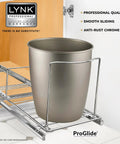 Heavy Duty Adjustable Cabinet Pullout Organizer with a gray trash can on chrome sliding rack under kitchen cabinet.