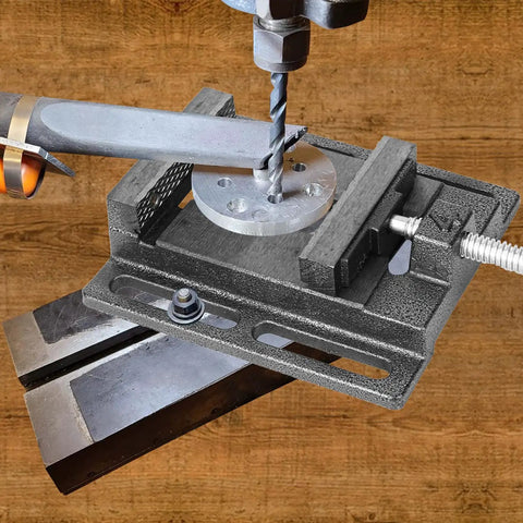 2 Pack 4 Inch Portable Drill Press Vise With Slotted Base Made From Durable Cast Iron For Dead Solid Grip Wood And Metal Clamping Light Duty Bench Fixture Easy Setup Workshop Staple Black, close-up view with drilled metal piece.