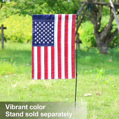 Two Pack American Flag Garden Flags Embroidered 12 By 18 Inches Deluxe Stars And Stripes USA Garden Flags in a yard