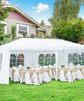 10x20 Outdoor Party Tent Canopy With Removable Walls set up in backyard with tables and chairs, white event shelter