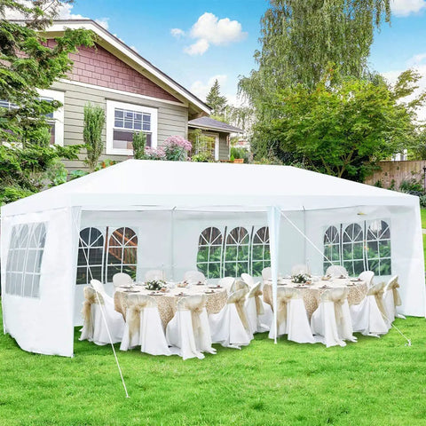 10x20 Outdoor Party Tent Canopy With Removable Walls set up in backyard with tables and chairs, white event shelter
