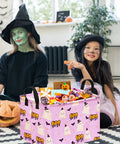 Lowkey Spooky Purple Ghost Storage Basket With Heavy Duty Cotton Linen Handles Dope Collapsible Organizer For Halloween Candy Toys Bedroom Closet Shelf Vibe Refresh filled with candy next to children in costumes.