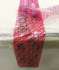 Tamper-evident packing tape, red void pattern, installed on a box seam; 2 in x 55 yd, 2 mil, Amazon TamperSeals