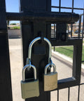 Super Secure Dual Padlock Gate Lock Killing Messy Daisy Chains For Hella Tough Barn Yard Protection with two padlocks on gate.
