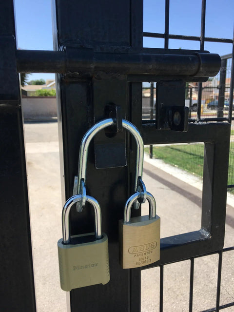 Super Secure Dual Padlock Gate Lock Killing Messy Daisy Chains For Hella Tough Barn Yard Protection with two padlocks on gate.