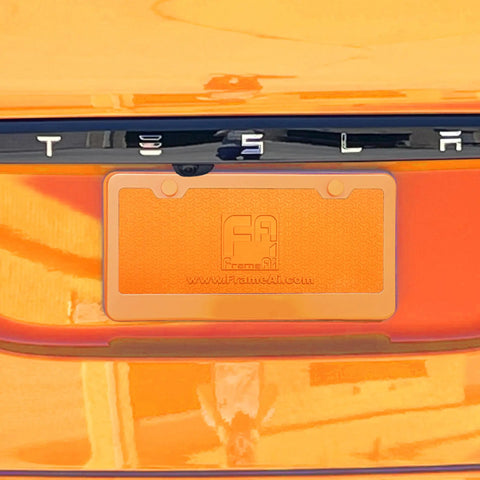 Orange 8K Mirror Polished Stainless Steel License Plate Frame With Rust Resistant Build on Tesla rear