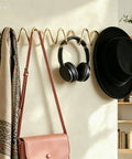 Heavy Duty Gold Wall Mounted Coat Rack With Sculpted Wavy Hooks Hanging Coats Hats Bags And Umbrellas Zero Clutter Bedroom Decor For Living Rooms And Bathrooms Top Shelf Build with bags and headphones.