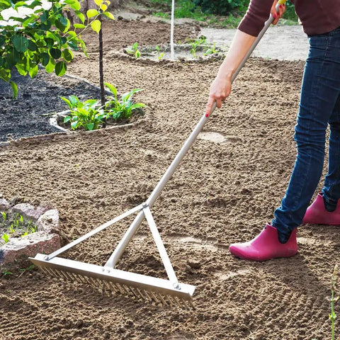 Person using Landscape Rake With Aluminum Head And 68 Inch Handle, 24 Inch Width With 24 Tines, Ideal For Smoothing Gravel, Driveways
