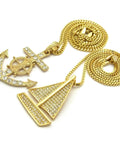 Dope Iced Out Sailboat Yacht And Anchor Pendant Necklace Set In Gold Tone With Two Necklace Set And Layered Chains Including 20 Inch Box Chain And 24 Inch Cuban Chain Plus 30 Inch Long Option For Maximum Bling. Image shows gold-tone sailboat and anchor pendants with chains.