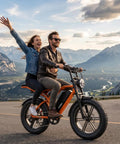Couple riding Solid Ride Adult Electric Bike With Upgraded 48V Removable Battery And Dope 1500 Watt Peak Motor in vibrant orange.