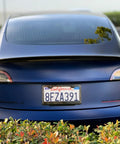 Real Molded Carbon Fiber Matte Dry Look Spoiler For Tesla Model 3 from rear view, enhancing sporty design and stability.