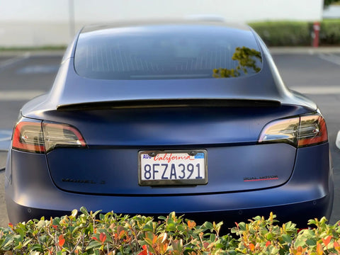 Real Molded Carbon Fiber Matte Dry Look Spoiler For Tesla Model 3 from rear view, enhancing sporty design and stability.
