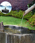 Seven Point Five Watt Solar Water Pump For Ponds And Fountains With DIY Five Foot Tubing Dry Run Protected in stone water feature