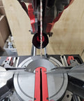 Close-up of a 10-inch miter saw with Dust Collector And Dust Chute For Milwaukee 10 Inch Miter Saw 2734-20/21 Compatible installed